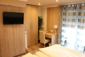 Telewizja i/lub zestaw kina domowego w obiekcie Pension Wachau