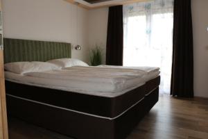 Łóżko lub łóżka w pokoju w obiekcie Pension Wachau