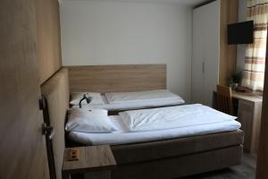 Łóżko lub łóżka w pokoju w obiekcie Pension Wachau