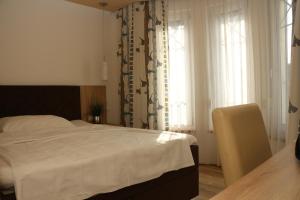 Łóżko lub łóżka w pokoju w obiekcie Pension Wachau