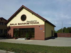 a building with a sign on the side of it at Kancelaria in Szczecin