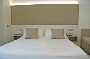 Cama ou camas em um quarto em Hotel Bologna