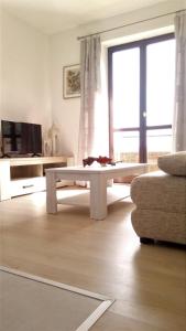 a living room with a coffee table and a couch at Apartments Anica in Sobra