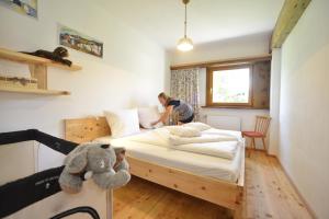 A bed or beds in a room at Schmiedhof