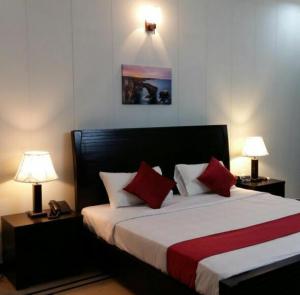 Ein Bett oder Betten in einem Zimmer der Unterkunft Stargaze Hotel & Apartment