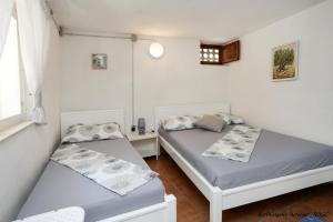 Postel nebo postele na pokoji v ubytování Robinson beach house Jogo