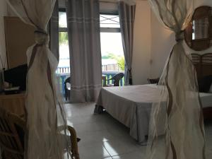 Postel nebo postele na pokoji v ubytování Coco Villa