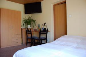Postel nebo postele na pokoji v ubytování Villa Orchidea