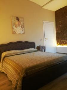 Ένα ή περισσότερα κρεβάτια σε δωμάτιο στο Montorfano Suite