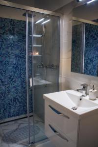 a bathroom with a sink and a shower at KUĆA ZA ODMOR NATALIJA in Pula +19 photos