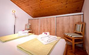 Postel nebo postele na pokoji v ubytování Apartmani Nivia