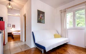 Postel nebo postele na pokoji v ubytování Apartmani Nivia