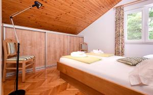 Postel nebo postele na pokoji v ubytování Apartmani Nivia