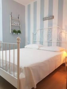 Postel nebo postele na pokoji v ubytování Hercules House - Il riposo degli Eroi