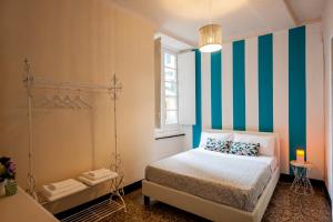 Voodi või voodid majutusasutuse Old Genoa Rooms & Apartments toas