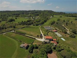 an aerial view of a farm with a train track at Caserio de Fontes in Nogueira de Ramuin