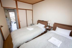 Postel nebo postele na pokoji v ubytování Lazy House