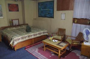 Postel nebo postele na pokoji v ubytování Orchard Huts