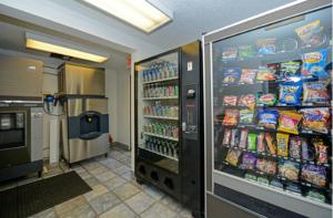 a grocery store aisle with a soda vending machine at Americas Best Value Inn & Suites Jackson in Jackson