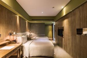 Voodi või voodid majutusasutuse inhouse Hotel toas