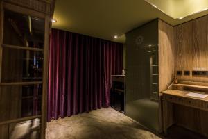 
a bathroom with a sink and a window at inhouse Hotel in Taipei
