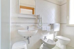 Kúpeľňa v ubytovaní Hotel Amedea