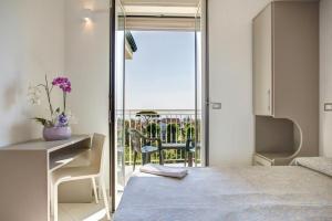 Posteľ alebo postele v izbe v ubytovaní Hotel Amedea