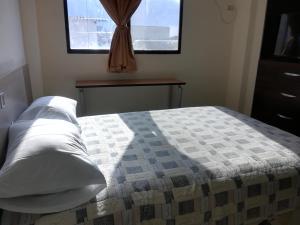 Postel nebo postele na pokoji v ubytování Alojamiento Castelnouvo, Entre Ríos, Guayaquil, Ecuador