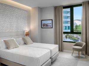 Posteľ alebo postele v izbe v ubytovaní Opera House Valencia B&B