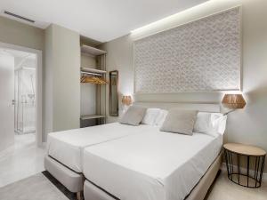 Posteľ alebo postele v izbe v ubytovaní Opera House Valencia B&B