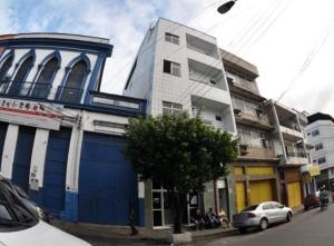 a blue building on the side of a city street at Hotel Granada Concept in Manaus