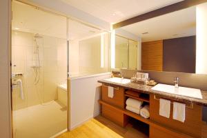 a bathroom with a sink, toilet, and shower at Nagoya Prince Hotel Sky Tower in Nagoya