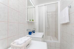 Kúpeľňa v ubytovaní City Core Apartment + 12 fotografií