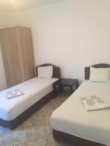 Postel nebo postele na pokoji v ubytování DK Apartmani