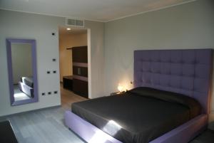 Postel nebo postele na pokoji v ubytování Blue Hotel