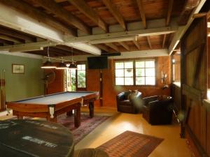 a living room with a pool table in it at The Stables in Cooroy