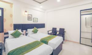 Treebo Chalets, Nagpur Airport客房内的一张或多张床位