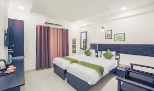 Treebo Chalets, Nagpur Airport客房内的一张或多张床位