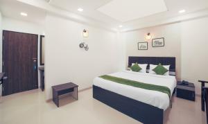 Treebo Chalets, Nagpur Airport客房内的一张或多张床位