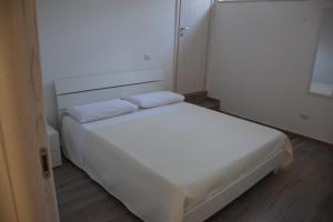 Posteľ alebo postele v izbe v ubytovaní Dimora Santa Caterina