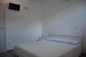 Posteľ alebo postele v izbe v ubytovaní Dimora Santa Caterina