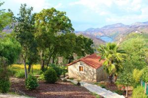 a house with a view of the mountains at Oak Cottage in Ferreira do Zêzere
