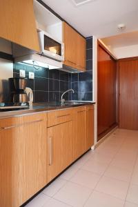 A kitchen or kitchenette at UHC Salou Pacific Apartments