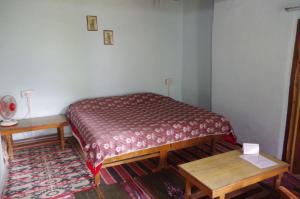 Postel nebo postele na pokoji v ubytování Orchard Huts