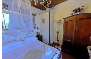 A bed or beds in a room at B&B Casa Angelieri