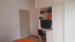 A television and/or entertainment centre at Sole D'oro IUN S4354
