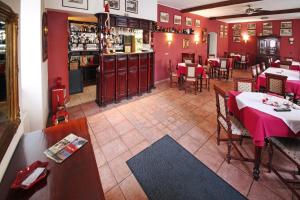 an overhead view of a restaurant with red walls at Penzion a Restaurace Stará Roudná in Pilsen