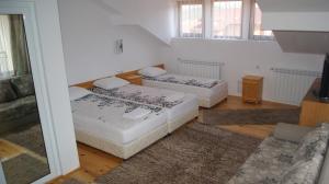 Postel nebo postele na pokoji v ubytování Guest House Garbevi