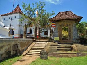 a gazebo in front of a building with stairs at Holiday Home Bentota in Bentota