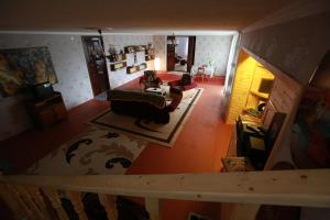 an overhead view of a living room with a couch at Ismayilli Guest House in İsmayıllı
